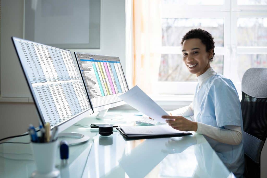 Black woman doing medical billing and coding
